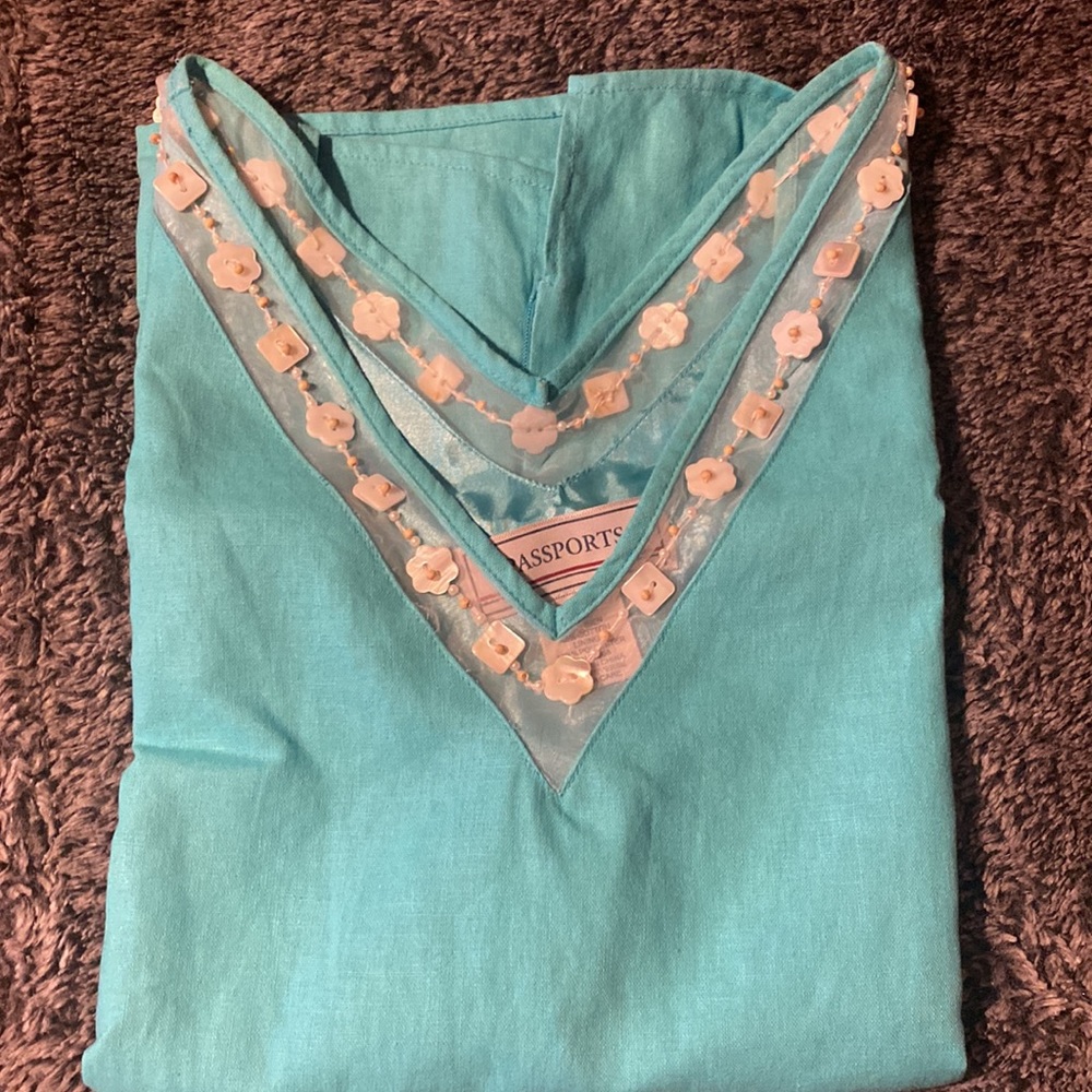 Turquoise blouse with designer beads V-neck with zipper on side and has lining.